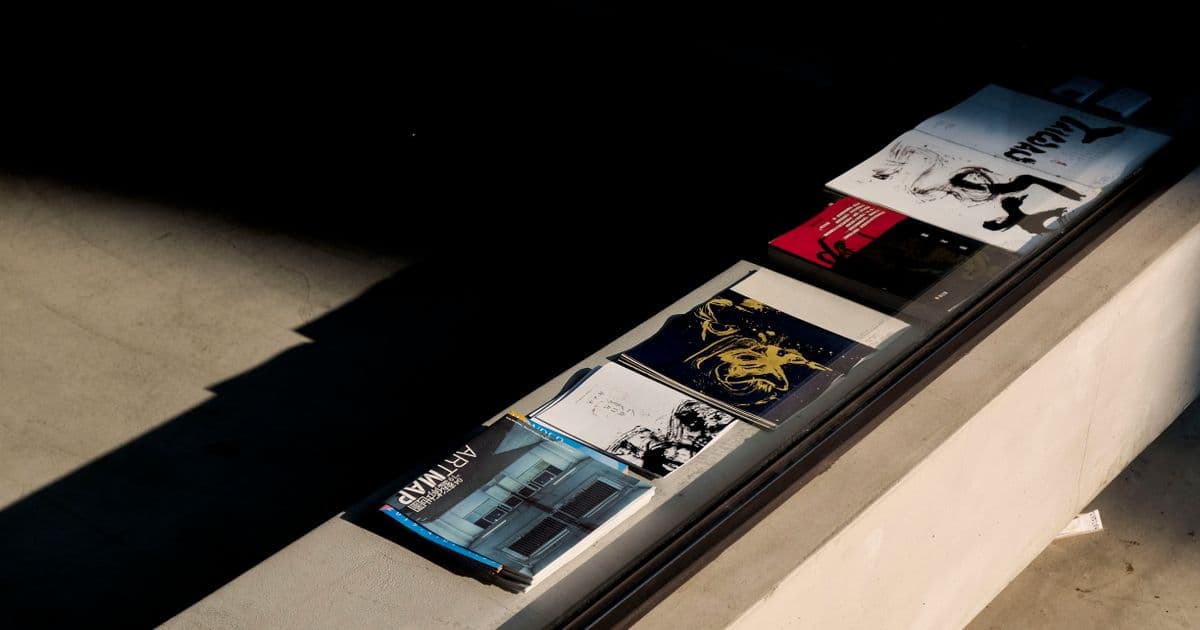 Printed design work laid out in a shaft of light